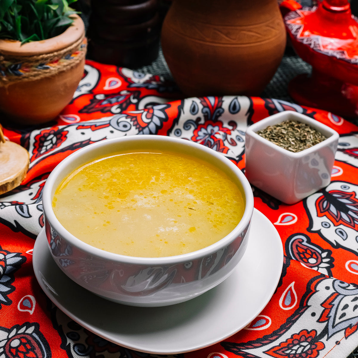 Kop vetvrije bouillon met een soepstengel of 2 Melba toastjes Mijn Momentum Mein Momentum